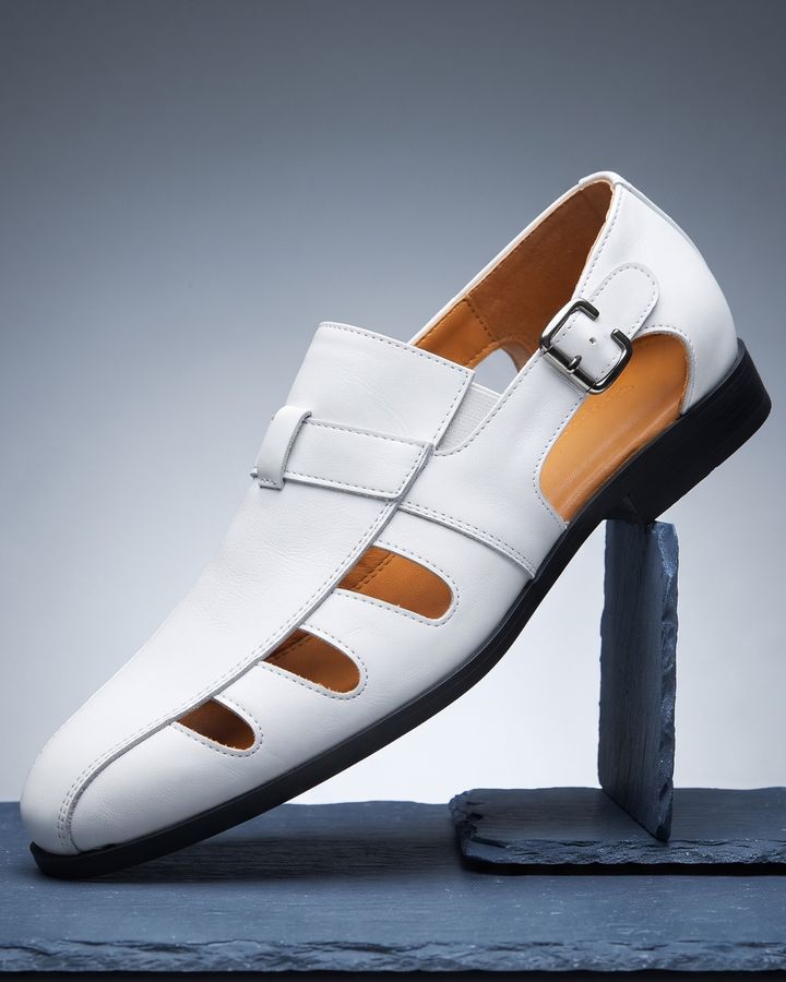 Monk-strap dress loafer with cutout vamp detailing and buckle fastening