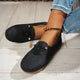 Women's low-profile lace-up moccasin shoes with stitched trim and flat textured soles