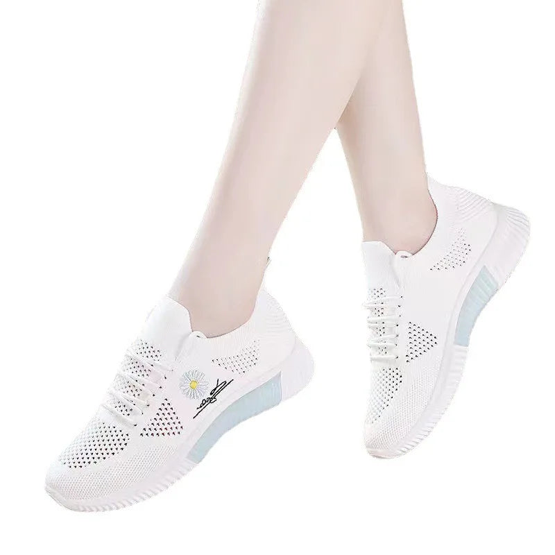 Women's textured lace-up sneakers with floral side detail and ridged soles