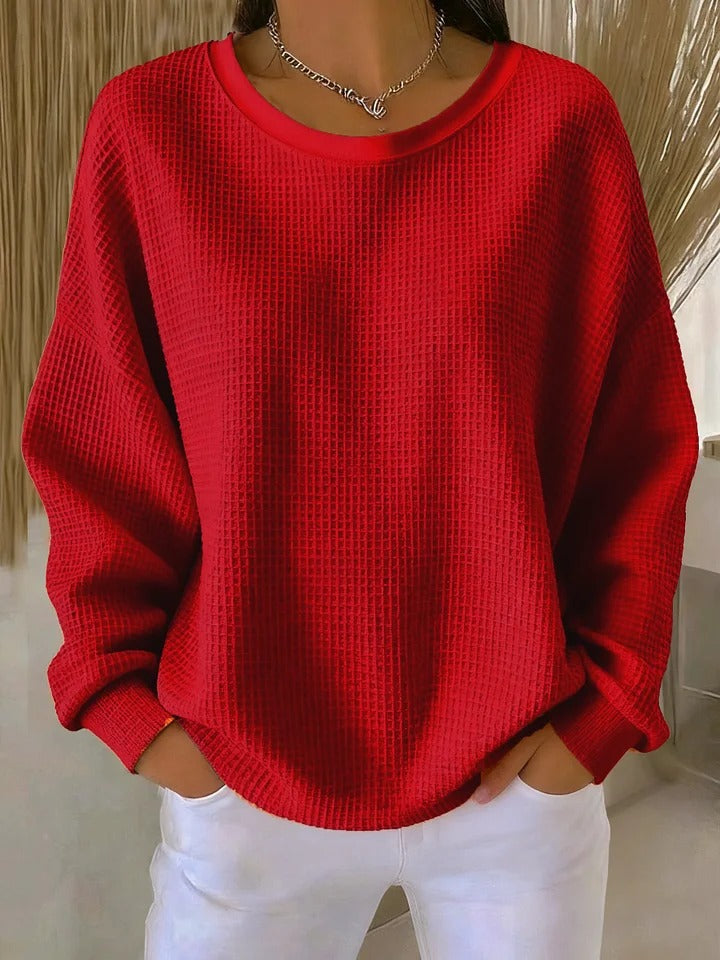 Women's textured crew neck sweater with long sleeves and ribbed cuffs