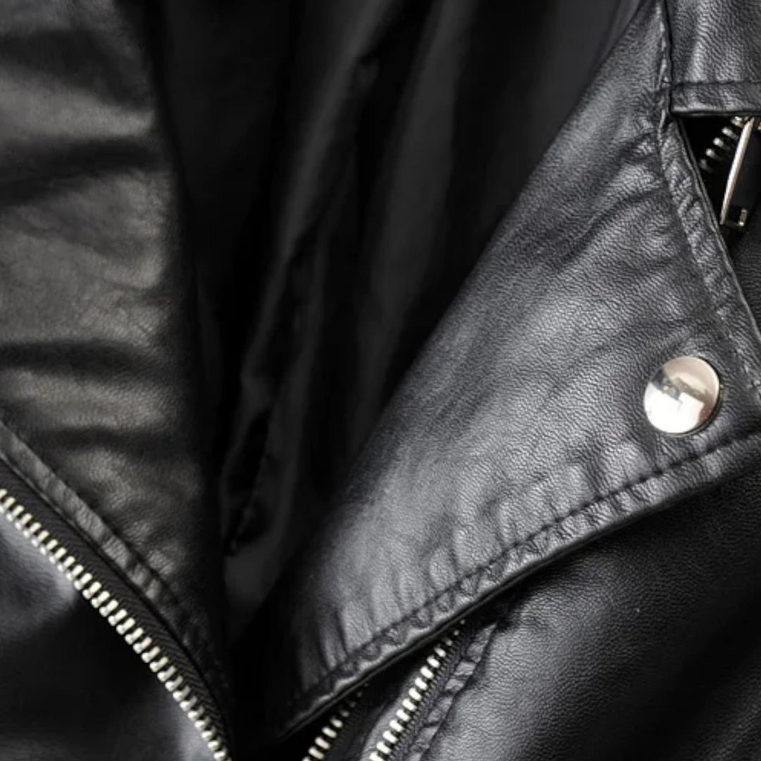 Women's black biker jacket with diagonal zip front and quilted sleeves