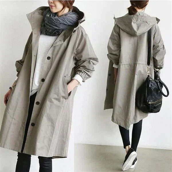 Women's oversized hooded mid-length trench coat with button front and side pockets