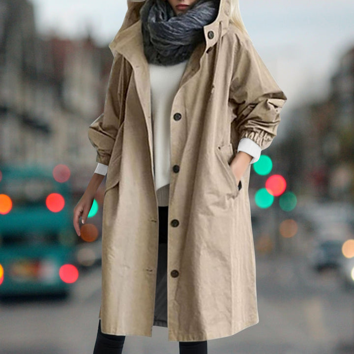 Women's hooded longline rain coat with button front and gathered cuffs