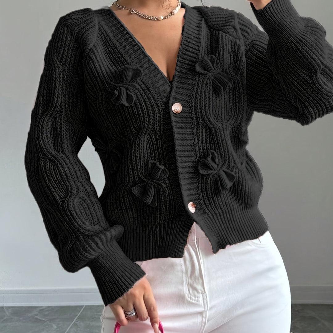 Women's ribbed V-neck cardigan with bow details and button front