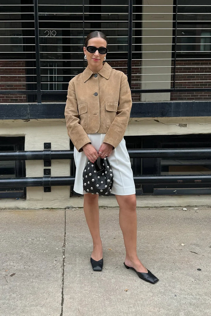 Women's beige cropped jacket with pointed collar and front flap pockets