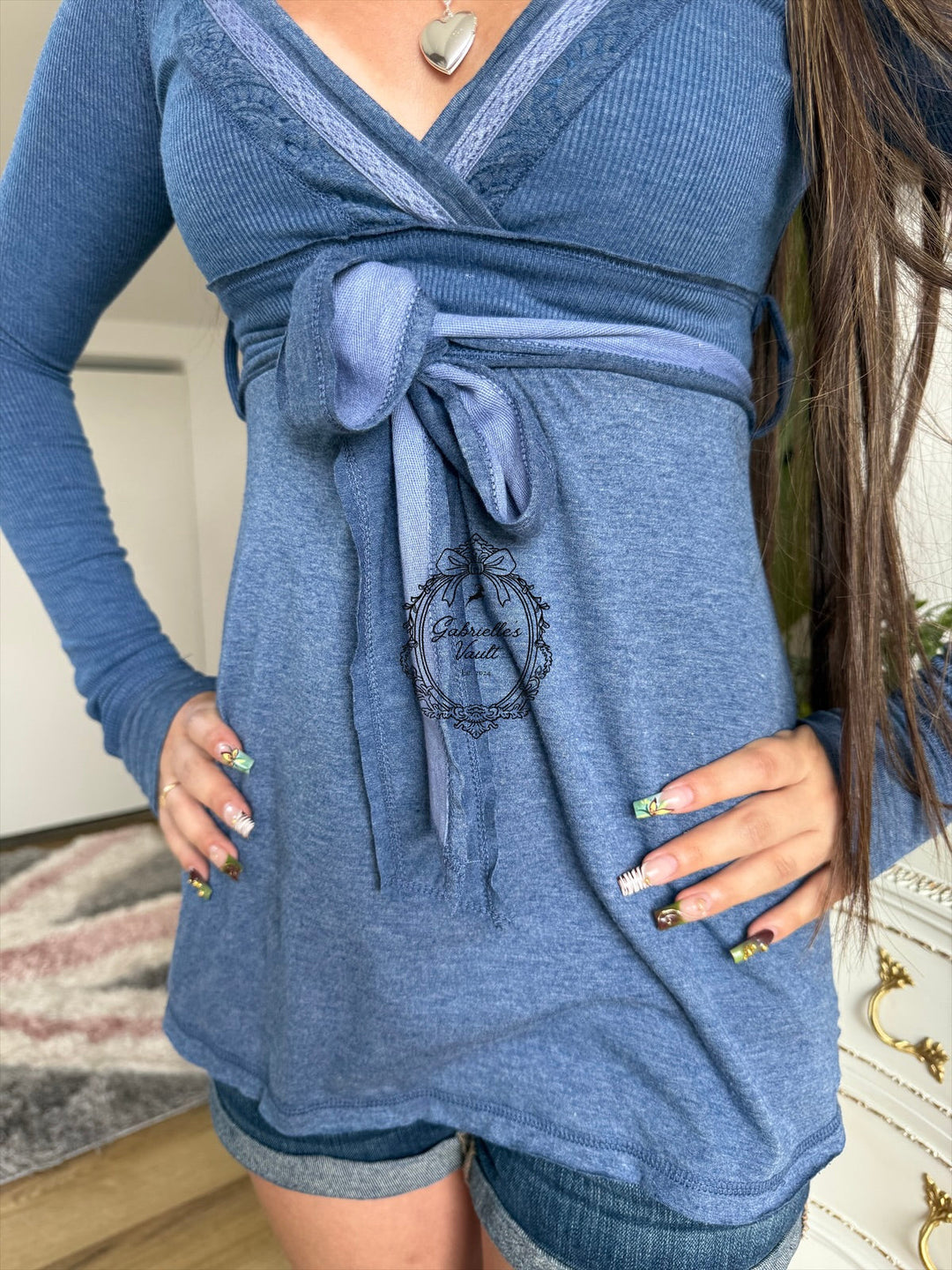 Women's ribbed wrap babydoll top with V-neckline and long sleeves