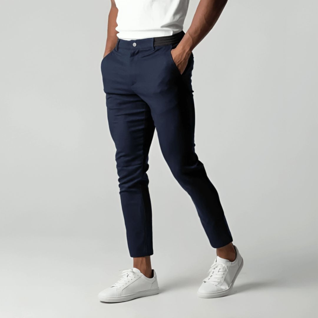 Men's slim tapered cropped chino pants shown in black and navy with side pockets and button closure