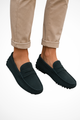 Men's slip-on moc toe loafers with stitched detailing and flat textured soles