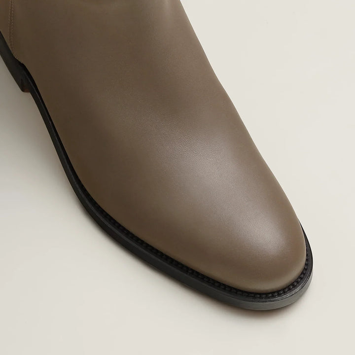 Women's tall knee-high riding boots with strap detail