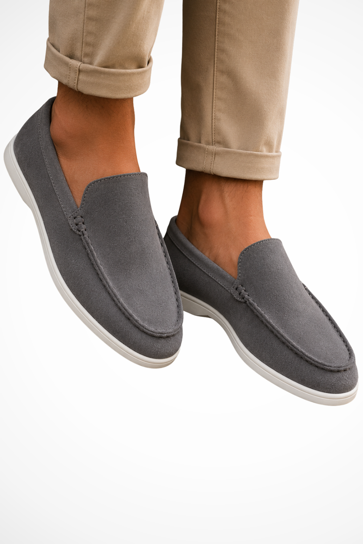 Men's slip-on loafers with rounded moc toe stitching and flat white soles