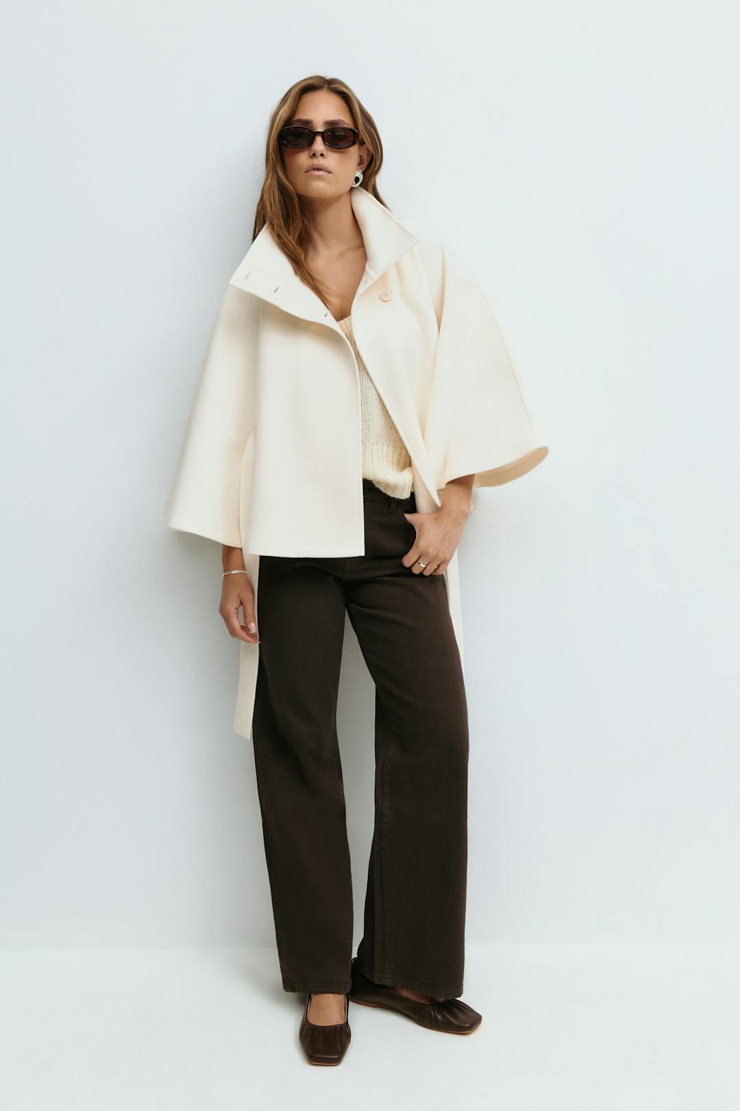 Women's belted cape coat with high collar and button front