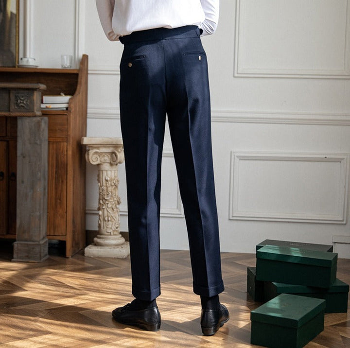 Pleated trousers with side waist tabs, belt loops and cuffed hems