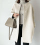 Women's long knitted cardigan with round neckline, long sleeves and button front