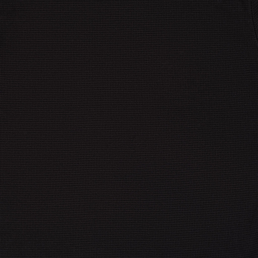 Black long sleeve crew neck top with ribbed cuffs and hem
