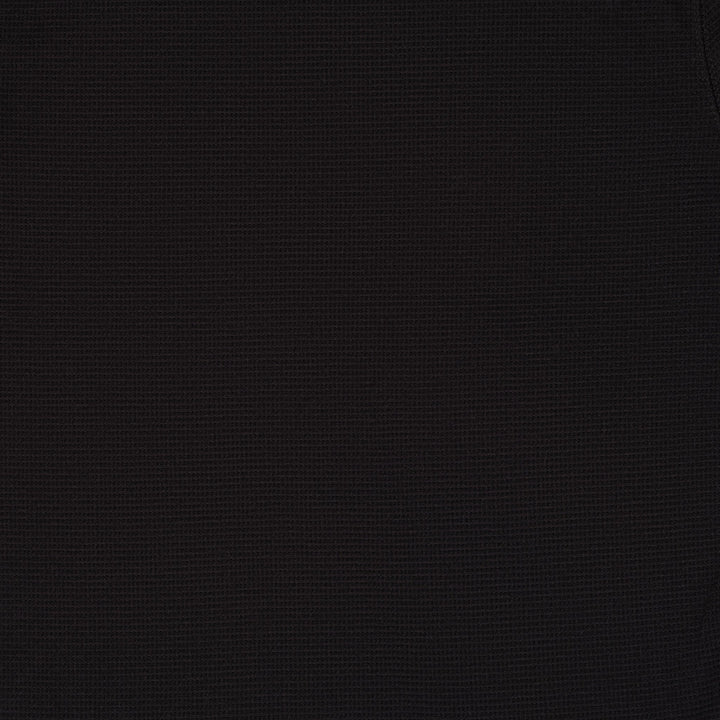 Black long sleeve crew neck top with ribbed cuffs and hem