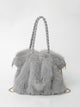 Faux fur shoulder bag with braided handles and chain strap