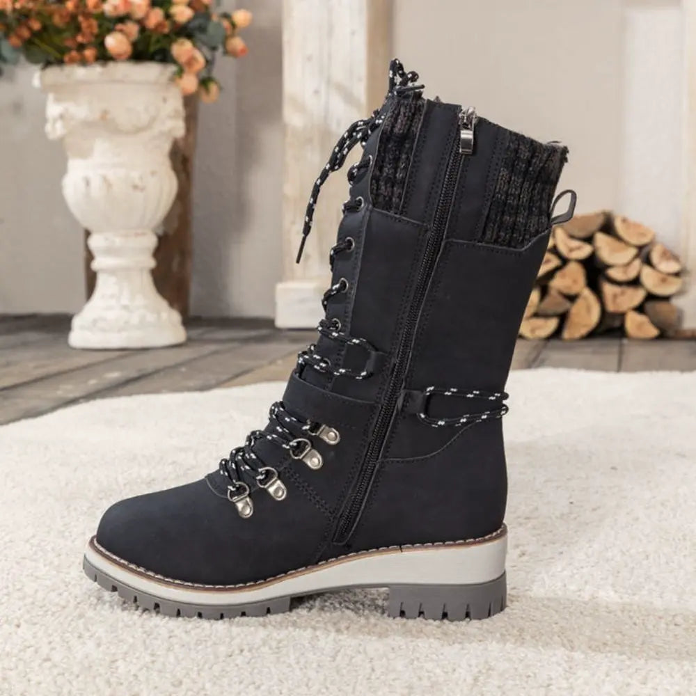 Women's lace-up snow boots with buckle strap and lug sole