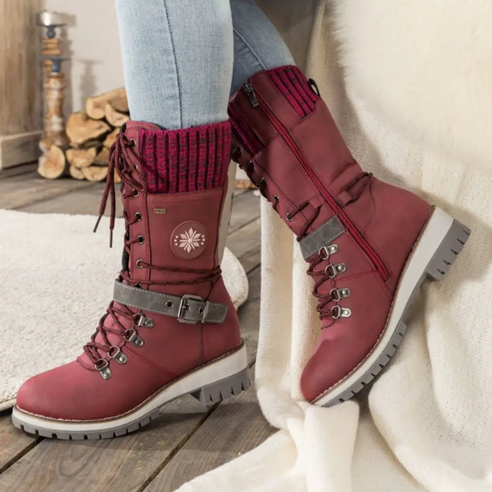 Women's lace-up snow boots with buckle strap and lug sole