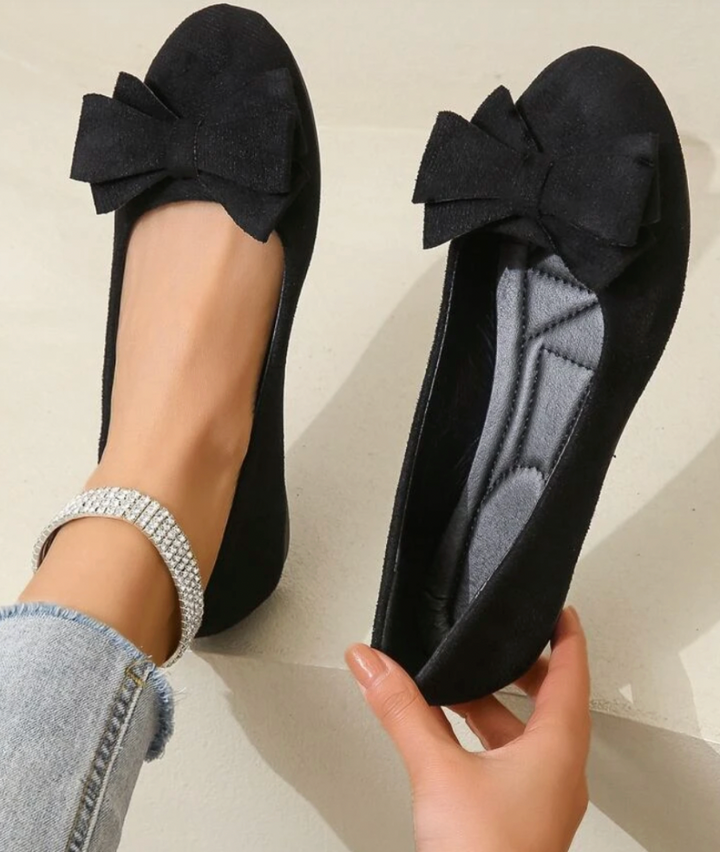 Bow detail flat loafers shown in black and dark green
