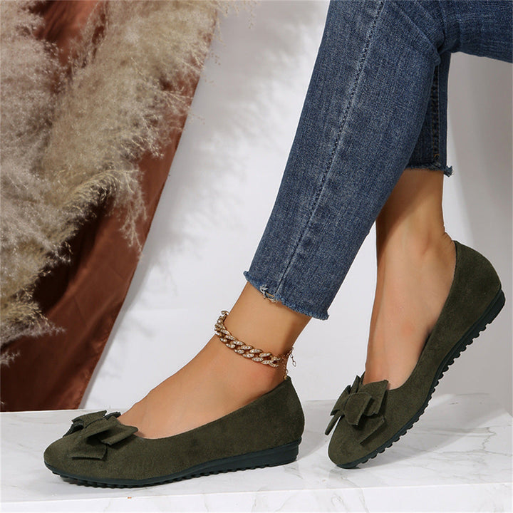 Bow detail flat loafers shown in black and dark green