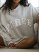 Women's grey oversized sweatshirt with white PARK lettering