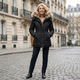Women's quilted hooded winter jacket with plush-looking trim