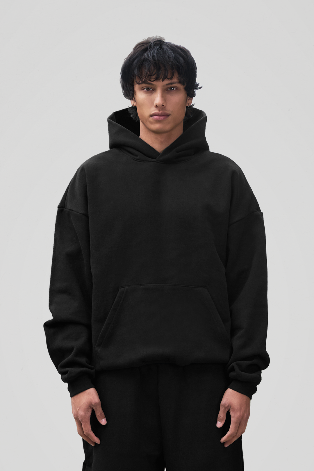Men's black oversized pullover hoodie with hood and kangaroo pocket