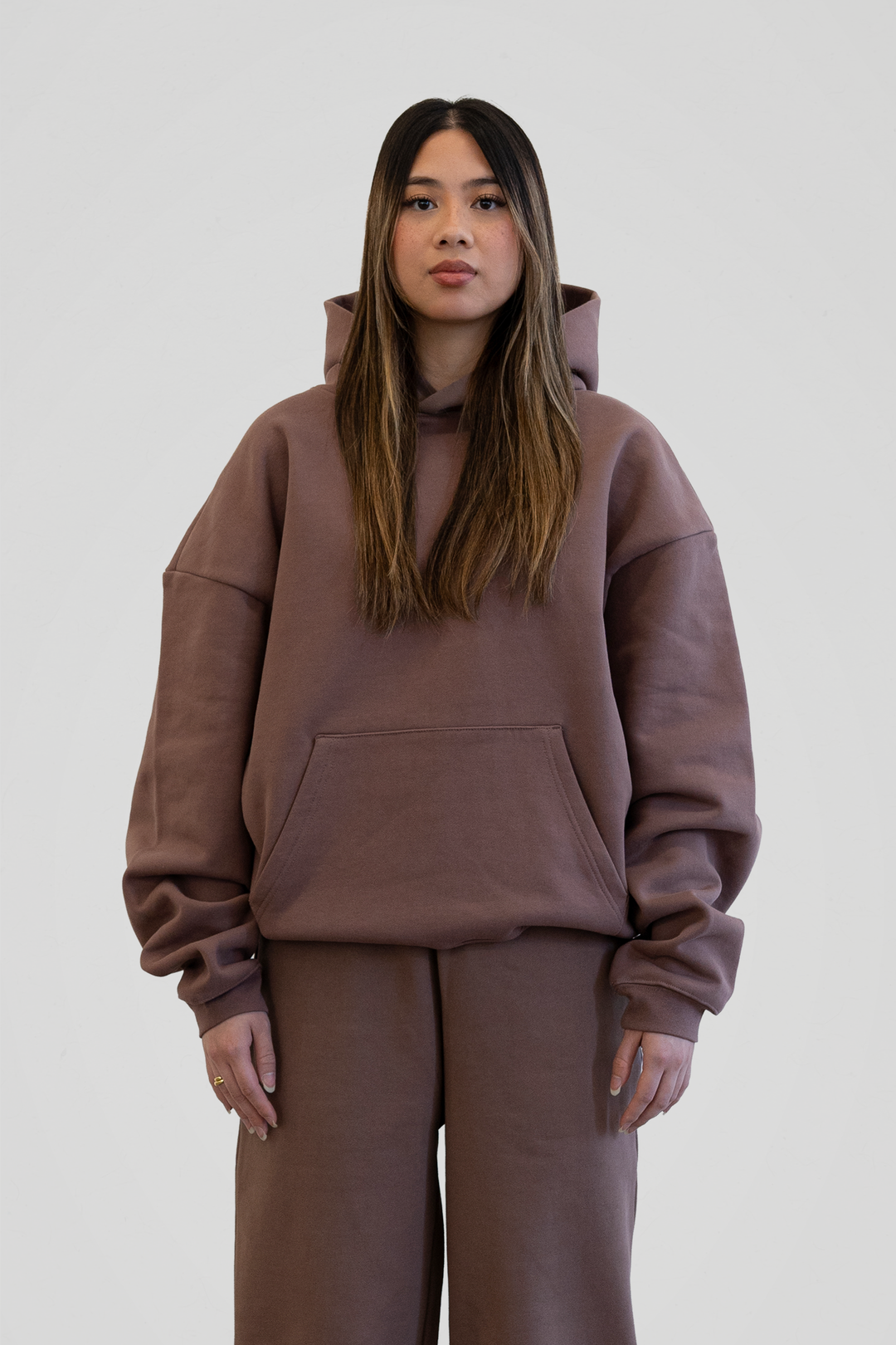 Brown unisex pullover hoodie with hood, long sleeves and front kangaroo pocket