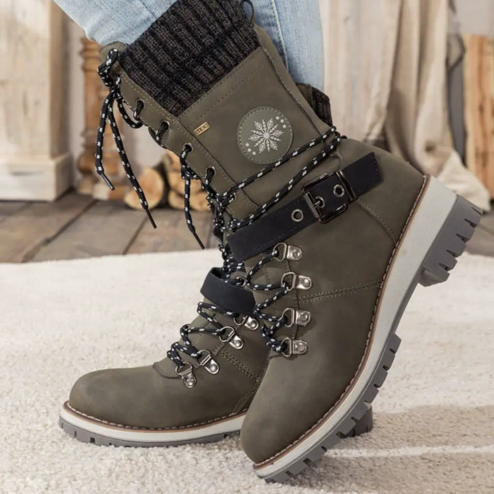 Women's lace-up snow boots with buckle strap and lug sole