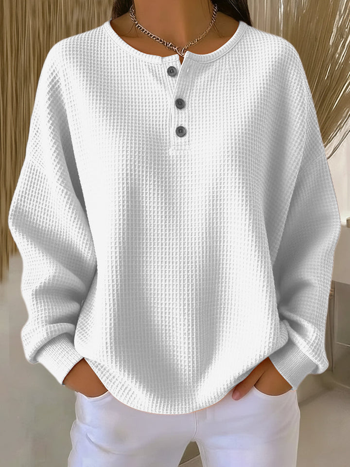 Women's waffle knit Henley top with long sleeves and button placket