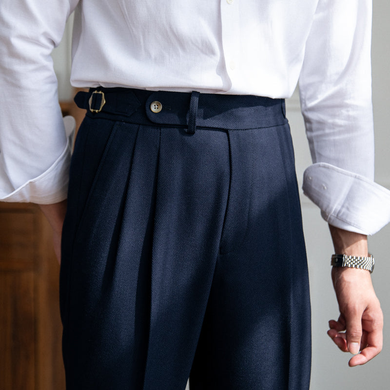 Pleated trousers with side waist tabs, belt loops and cuffed hems