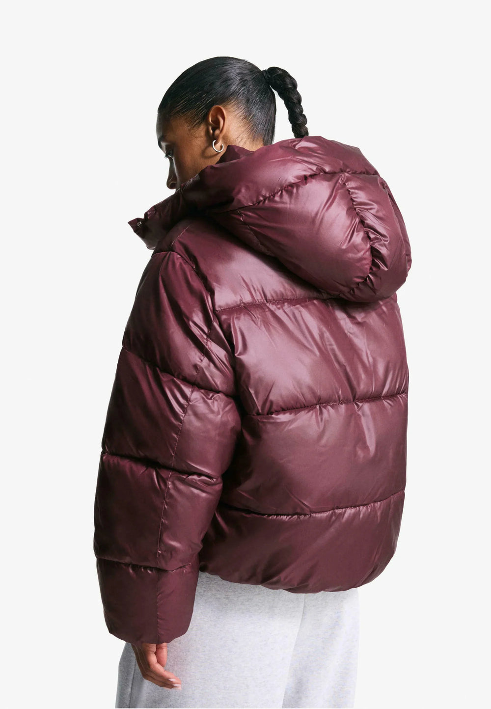 Women's burgundy hooded puffer jacket with quilted panels