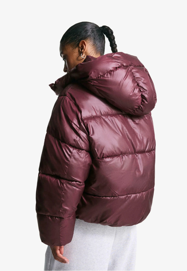 Women's burgundy hooded puffer jacket with quilted panels