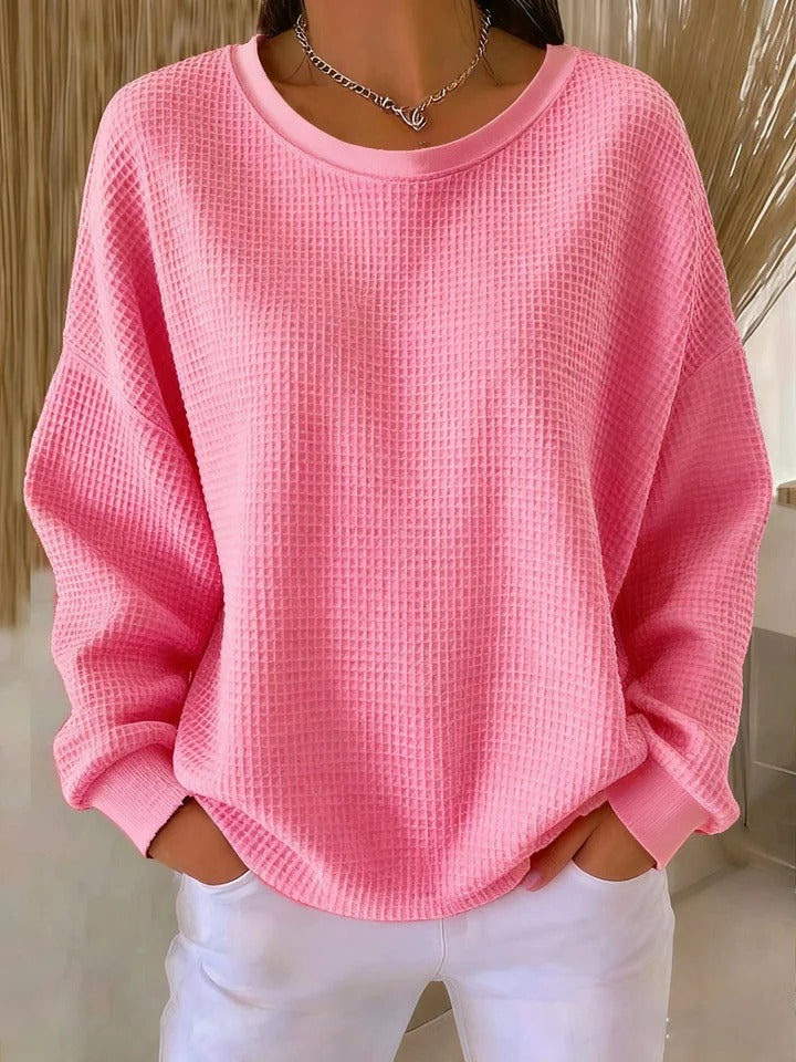 Women's textured crew neck sweater with long sleeves and ribbed cuffs