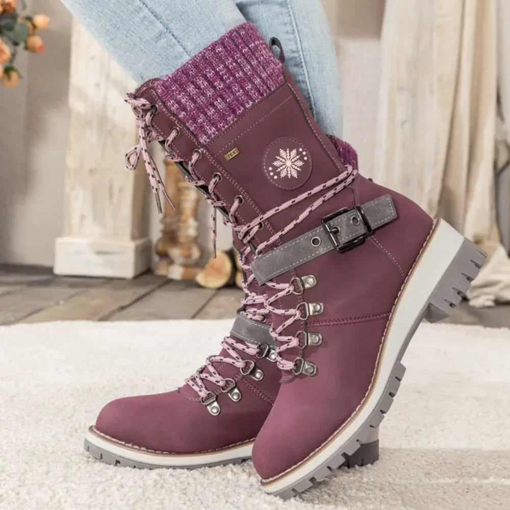 Women's lace-up snow boots with buckle strap and lug sole