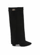Black knee-high boots with pointed toes, low heels and decorative buckle trim