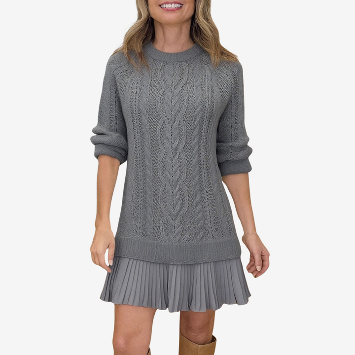 Women's cable knit dress with crew neck, long sleeves and pleated hem