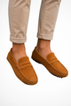 Men's slip-on moc toe loafers with stitched detailing and flat textured soles