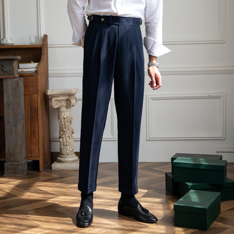 Pleated trousers with side waist tabs, belt loops and cuffed hems