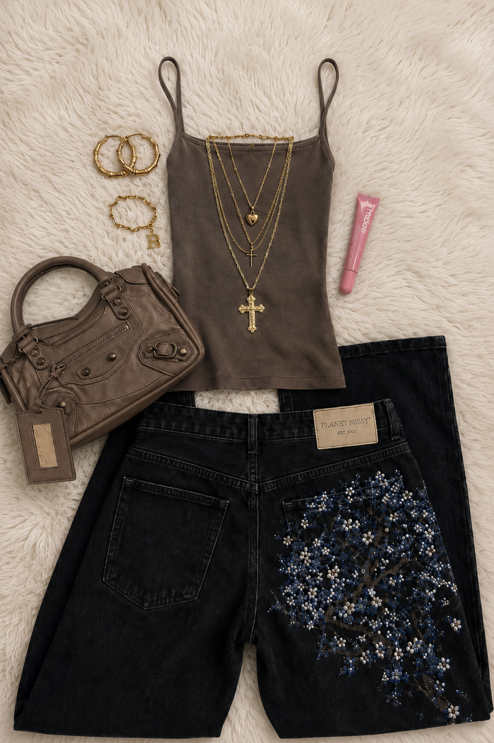 Women's black wide-leg jeans with blue floral embroidery