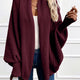Women's draped open-front cardigan with shawl collar and ribbed cuffs
