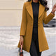 Women's long tailored coat with notched lapels and button front
