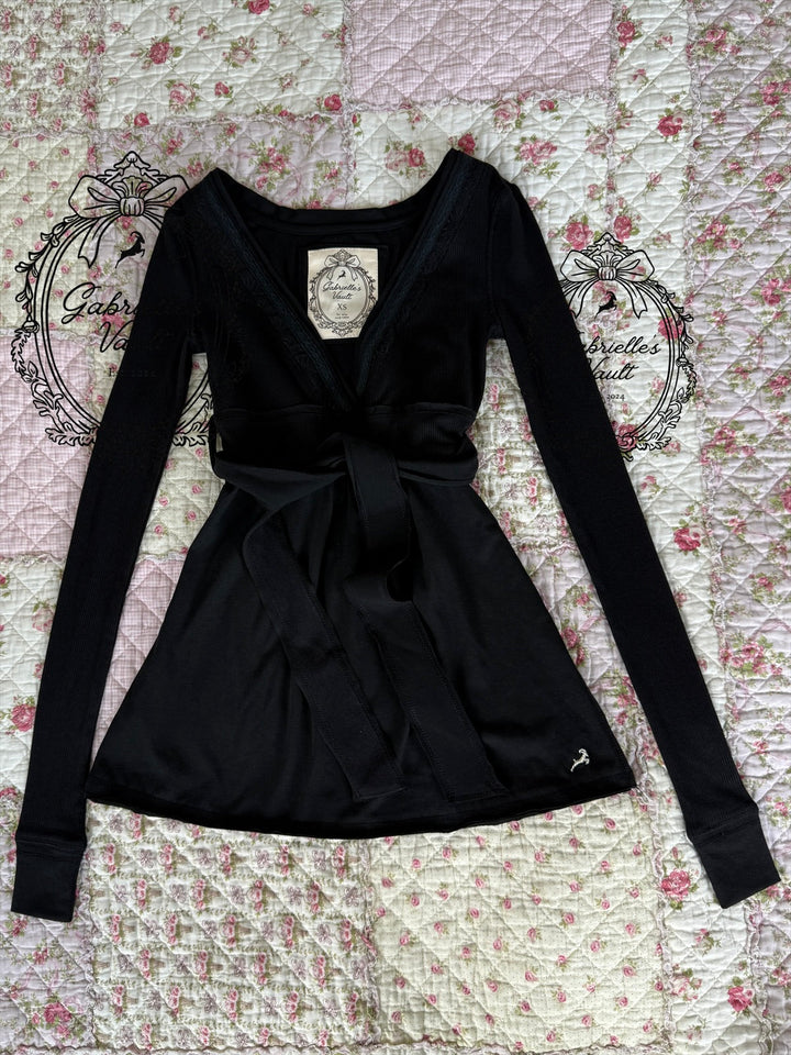 Women's ribbed wrap babydoll top with V-neckline and long sleeves