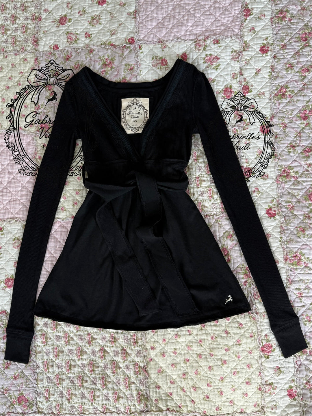 Women's long-sleeve wrap babydoll top with V-neck and tie waist