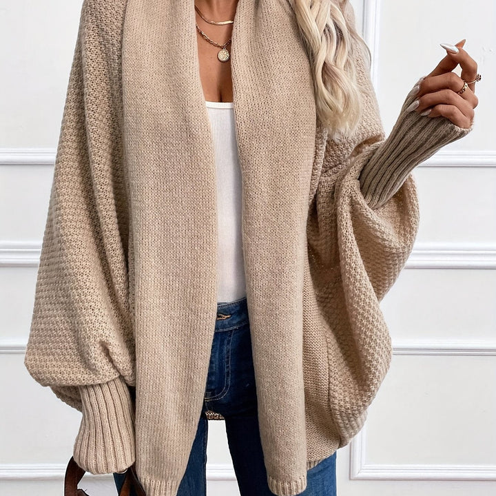 Women's draped open-front cardigan with shawl collar and ribbed cuffs