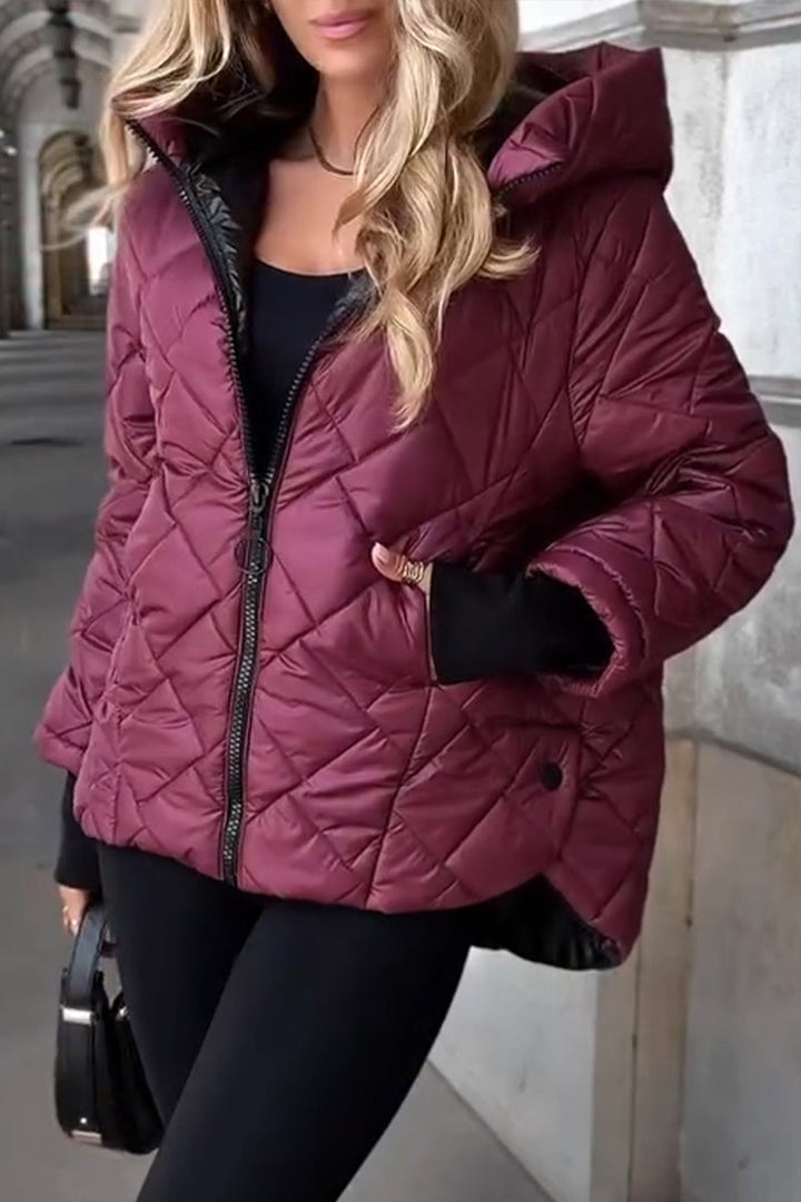 Women's quilted hooded puffer jacket with long sleeves and zip front