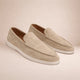 Men's casual slip-on loafers with moc toe stitching and flat white soles