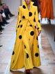 Women's yellow long coat with black polka dots and high lapel collar