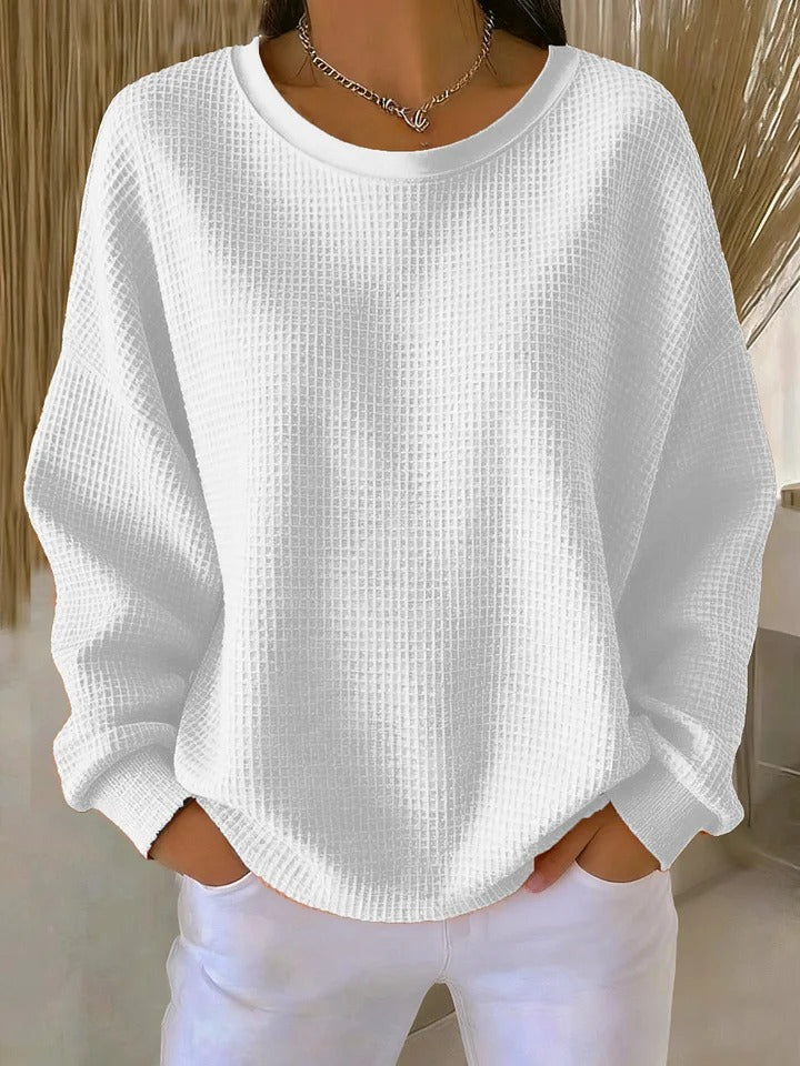 Women's textured crew neck sweater with long sleeves and ribbed cuffs