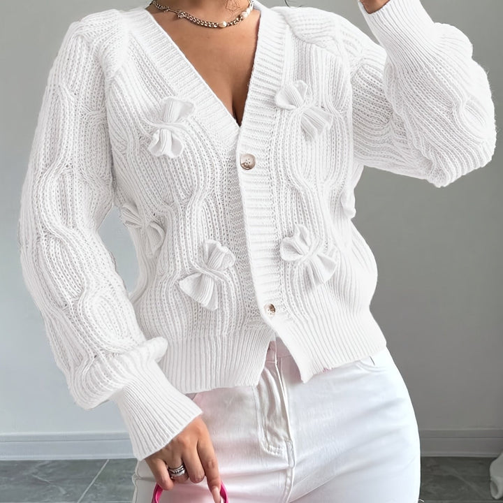 Women's ribbed V-neck cardigan with bow details and button front